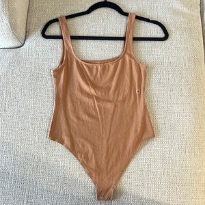 Brown body suit